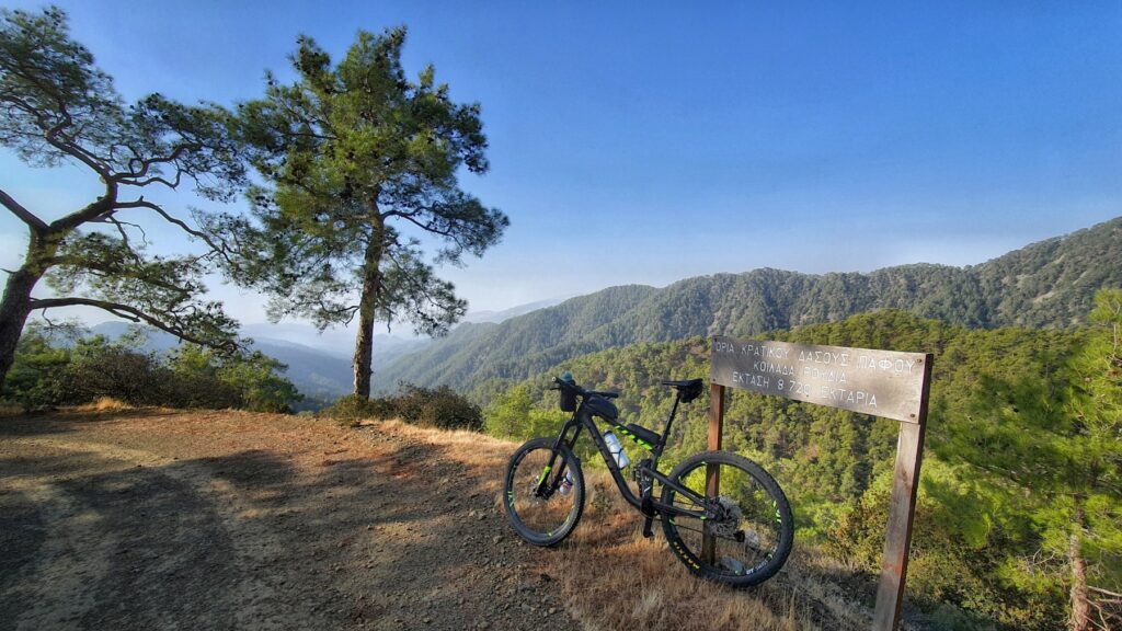 Mountain bike at mountain viewpoint in Cyprus with panoramic forest views