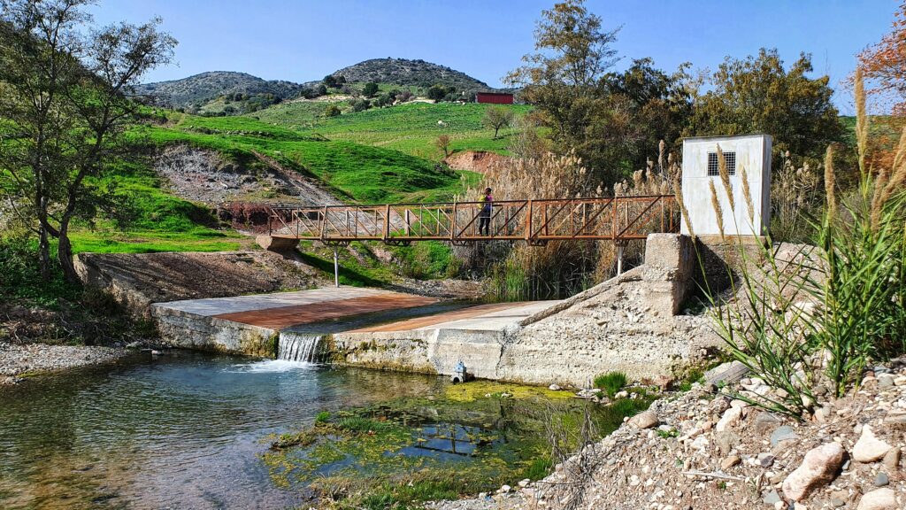 Riverside footbridge and stream along the Ezousa valley in Cyprus
